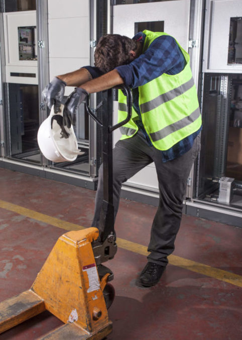 Tired warehouse worker